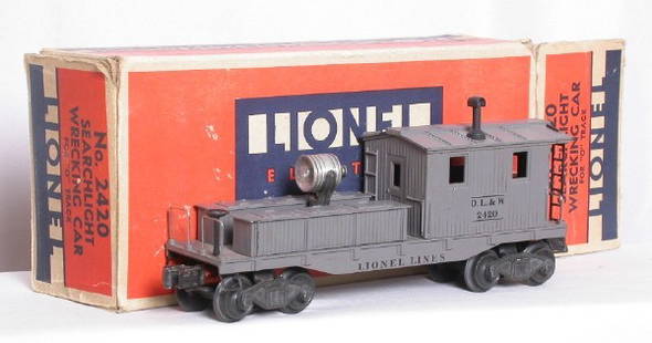 Lionel 2420 DL+W searchlight work caboose, OB.: Lionel 2420 DL+W searchlight work caboose, no rust, a few slight rubs, C6-7, OB includes insert and most flaps, though flaps either are taped or need to be taped on.