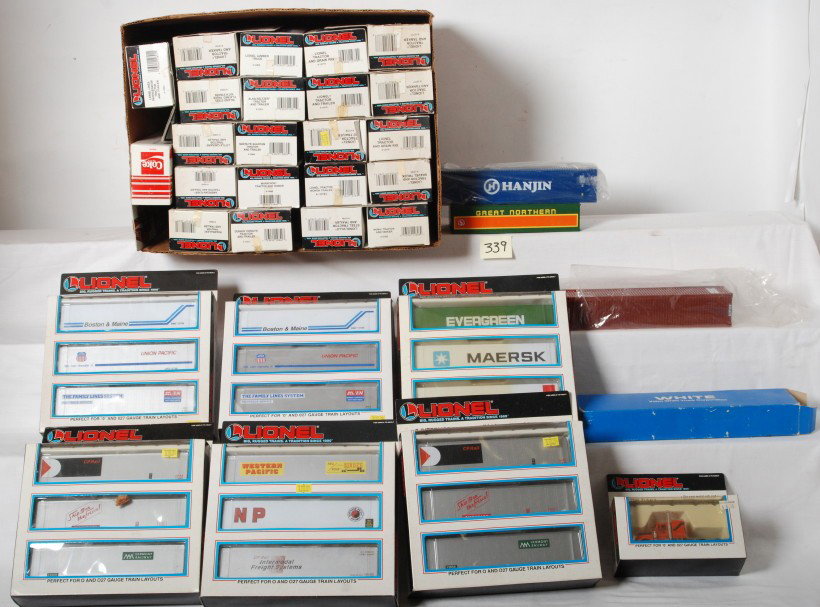 35 Lionel tractor trailers and intermodal containe: Lionel modern O gauge tractor trailers, semi trucks and more. Thirty pieces total. Catalog numbers are as follows, 12833, 12810, 12807, 12819, 12739, 12842, 12869, 12836, 12811, 12806, 12786, 12783, 1