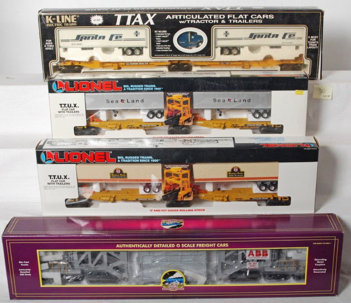 MTH Schnable, Lionel TTUX sets, K Line TTAX, etc.: Modern O gauge trains from MTH, Lionel, and K Line. Includes MTH 98291 ABB Schnable flatcar, two Lionel TTUX sets 16345 Southern Pacific and Sealand 16322 set. K Line TTAX Santa Fe set number K77023.