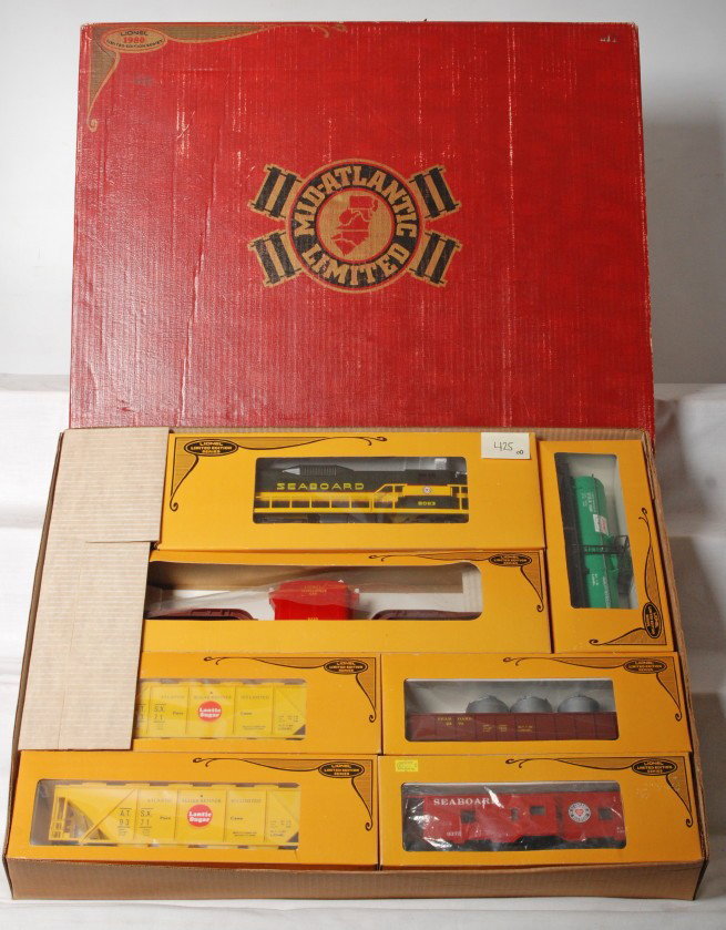 Lionel 1071 Mid-Atlantic Limited set: Lionel modern O gauge 1071 Mid-Atlantic Limited set consisting of 8063 Seaboard diesel, 9233 transformer car, 9369 Sinclair tank, 9370 Seaboard gondola, 9371 Lantic Sugar hopper and 9372 Seaboard bay 