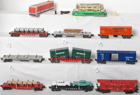 Lionel freight cars, one box, components: Postwar Lionel O gauge 6511 pipe car w/pipes, 6264 rail tie car w/ties, 6468 B&O boxcar, 3656 operating cattle car w/stockyard, 6424 automobile flatcar w/two repro cars, two 3361 operating lumber