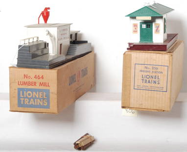 Lionel 256 and 464 in original boxes: Postwar Lionel O gauge accessories in original boxes. 256 freight station with two box inserts. 464 lumber mill with five logs and five timbers. Accessories should clean to look C6-7. 464 OB has