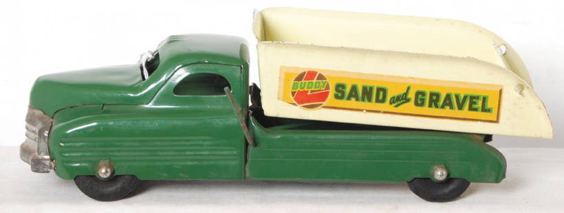 Buddy L pressed steel Sand and Gravel dump truck: Buddy L pressed steel Sand and Gravel dump truck C7. Truck measures approximately 13-1/4 inches long. Truck retains 90 percent or more original paint.