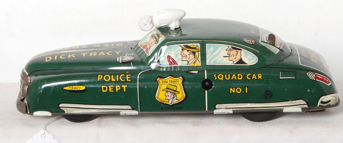 1949 Marx Dick Tracy Squad Car No. 1: Postwar 1949 Marx lithographed tinplate Dick Tracy Squad Car No. 1, clean battery compartment. Roof light has broken mount, O/W car looks very nice clean C8. Car repaints 95% or more original paint.