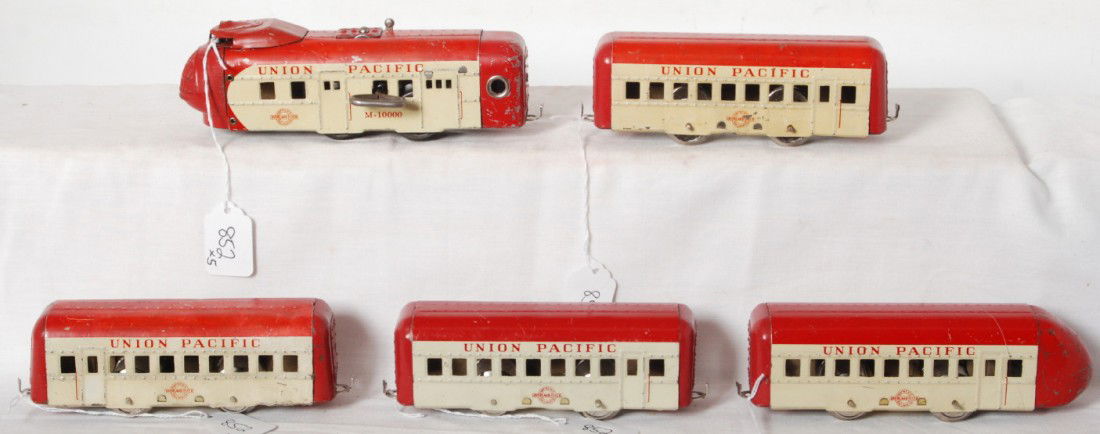 Hafner Union Pacific M-10000 streamlined passenger: Hafner O gauge mechanical lithographed tinplate Union Pacific m-10000 streamlined diesel passenger train. Train looks C6 with some fading. Cross bars on two car bodies are recycled Coca-Cola bottle ca