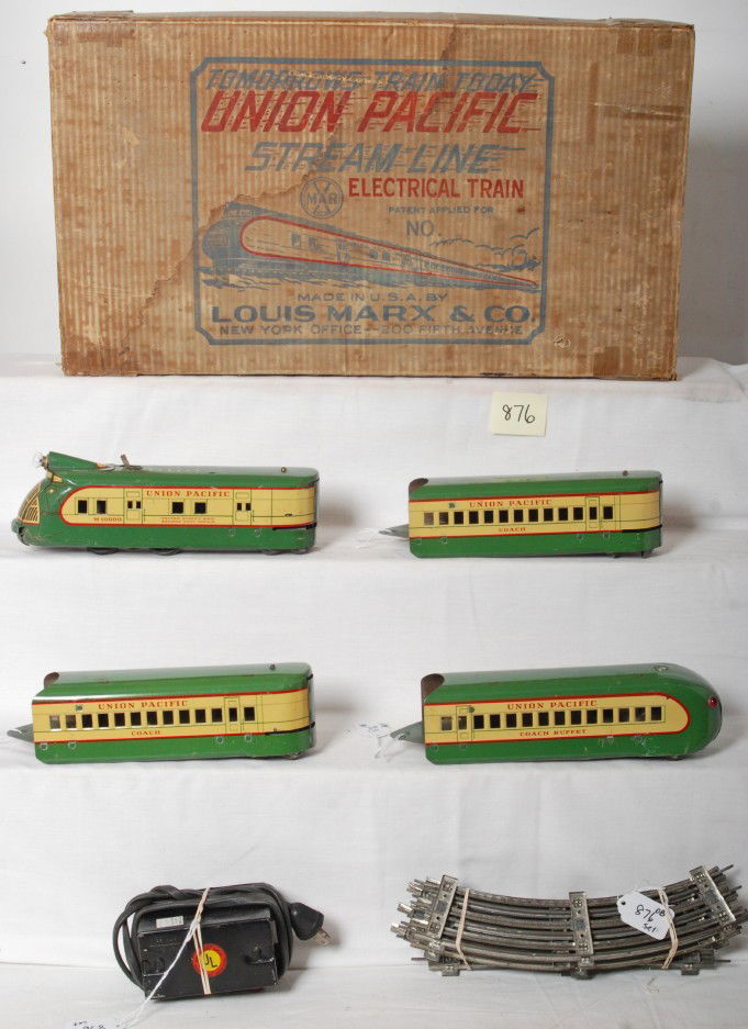 Marx No. 7090W Union Pacific streamline pass. in O: Postwar Marx No. 7090W Union Pacific streamline diesel passenger set in original set box with dividers. Trains include M100000 Union Pacific diesel RPO powered unit, two coaches, and a Coach buffet ob