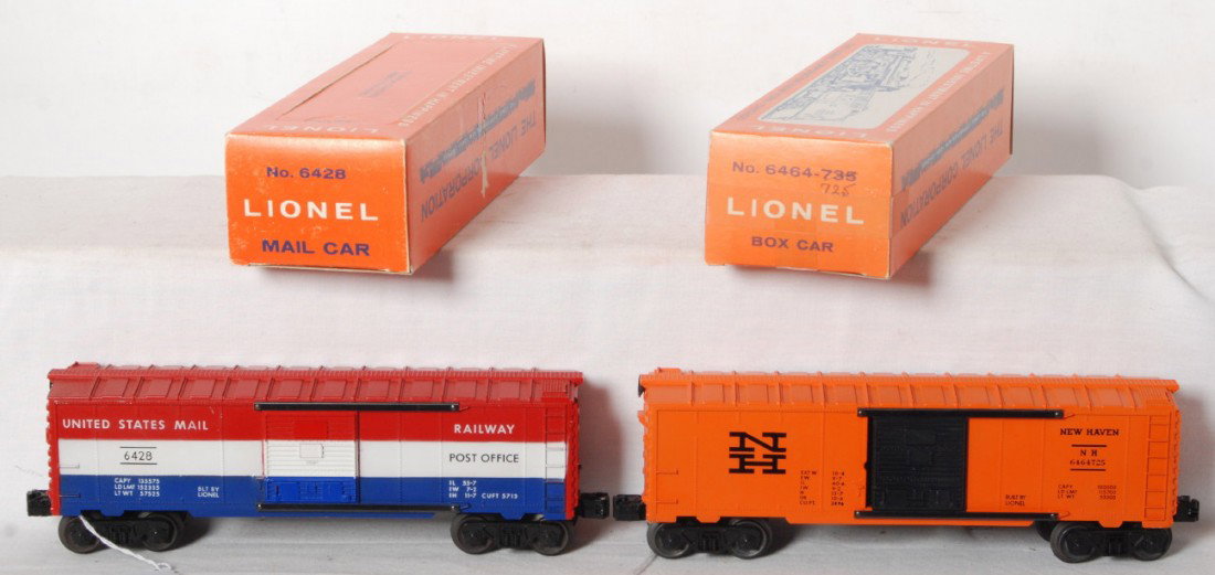 Lionel 6428 and 6464-725 boxcars in OB: Lionel postwar O gauge 6464-725 New Haven boxcar, unrun, C9-10. OB C7+. 6428 US Mail boxcar, slight rust on trucks, body is C8. OB is perf type, minor support tape on the inside, C8.