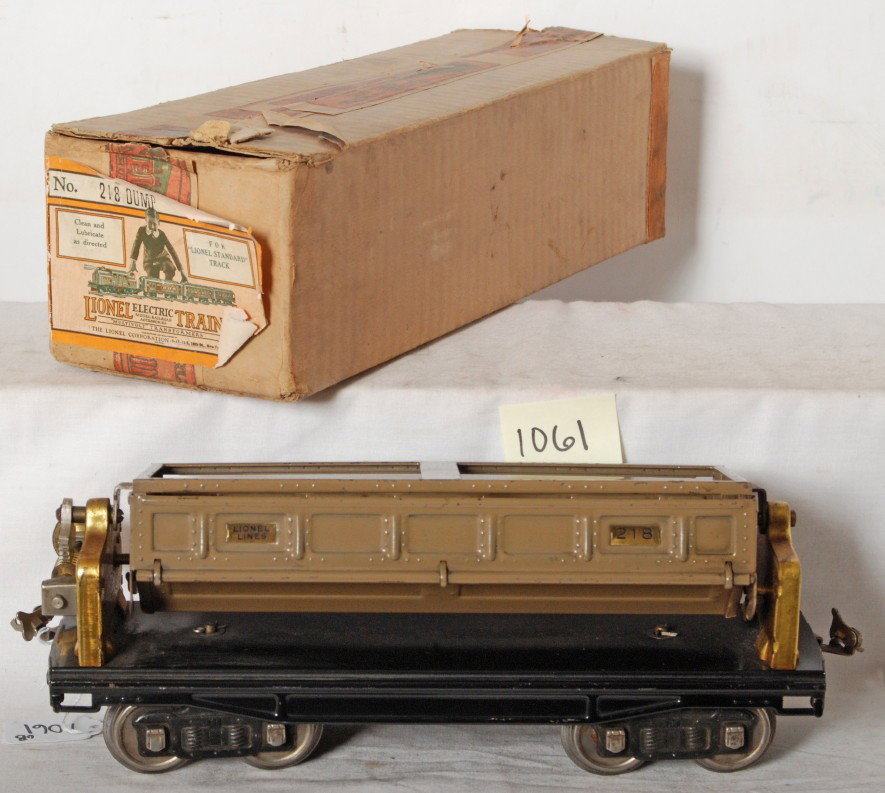 Lionel No. 218 dump car in original box: Prewar Lionel standard gauge No. 218 dump car in original box, C6+, should clean and polish to look a little better. Box has a little wear to a flap corner, O/W C8 area.