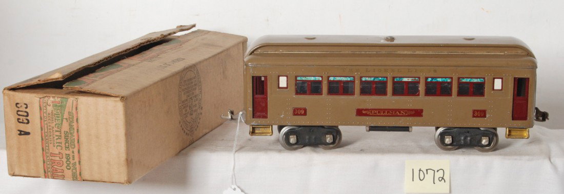 Lionel 309 Pullman in OB: Prewar Lionel standard gauge No. 309 Mojave Pullman with maroon doors, dinged at roof screw, nicer clean and shiny C6+. Box is marked 309 A, C8+.