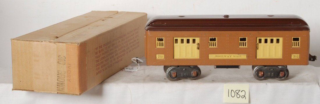 Lionel No. 310 Ivory Brown Railway Mail car in OB: Prewar Lionel standard gauge No. 310 Railway Mail/baggage car in original box, train should clean and polish C7 area. Box is marked 310-BROWN with IVORY having been stamped over 310-Brown, C8-9.