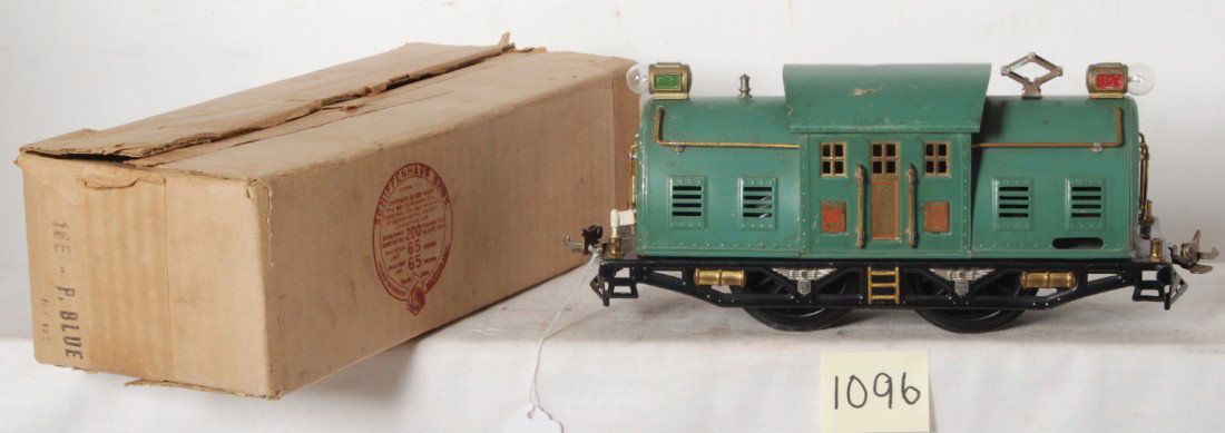 Lionel No. 10E Peacock Blue electric in OB: Prewar Lionel standard gauge No. 10E electric locomotive, dinged roof, very clean C6. Cloth taped corner is split open, O/W box is very square and solid with nice dark printing.