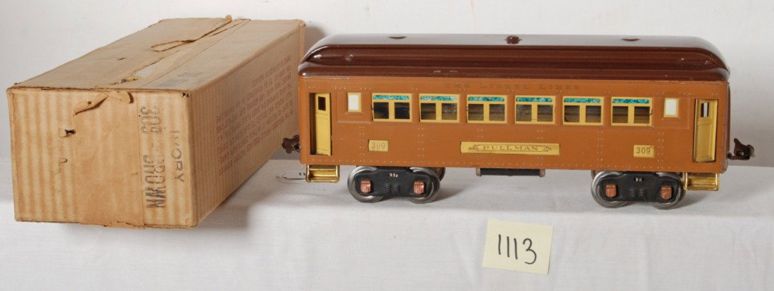 Lionel No. 309 Ivory/Brown Pullman in OB: Prewar Lionel standard gauge No. 309 Pullman in Ivory/Brown, low C7. Very clean and shiny car. Box is very square and solid with nice printing and no missing flaps.
