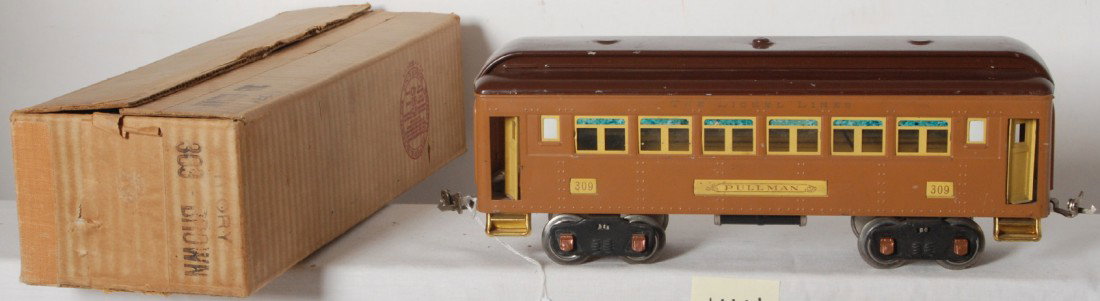 Lionel No. 309 Ivory/Brown Pullman in OB: Prewar Lionel standard gauge No. 309 Pullman in Ivory/Brown, C7. Very clean and shiny car. Box is very square and solid with minor coupler puncture, nice printing and no missing flaps