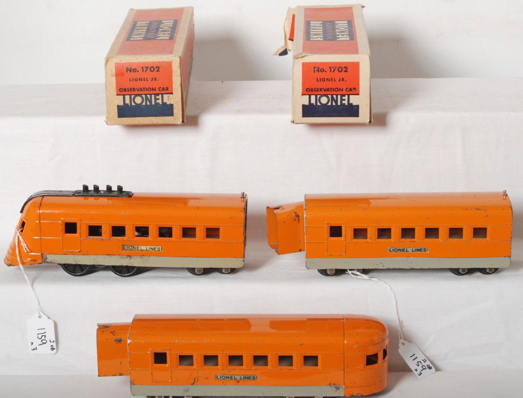 Lionel Jr. orange streamlined diesel passenger tr: Prewar Lionel O gauge Lionel Jr. orange streamlined diesel passenger train with two original boxes for 1702 observation cars. Train consists of powered unit, coach, and observation. Trains look very n