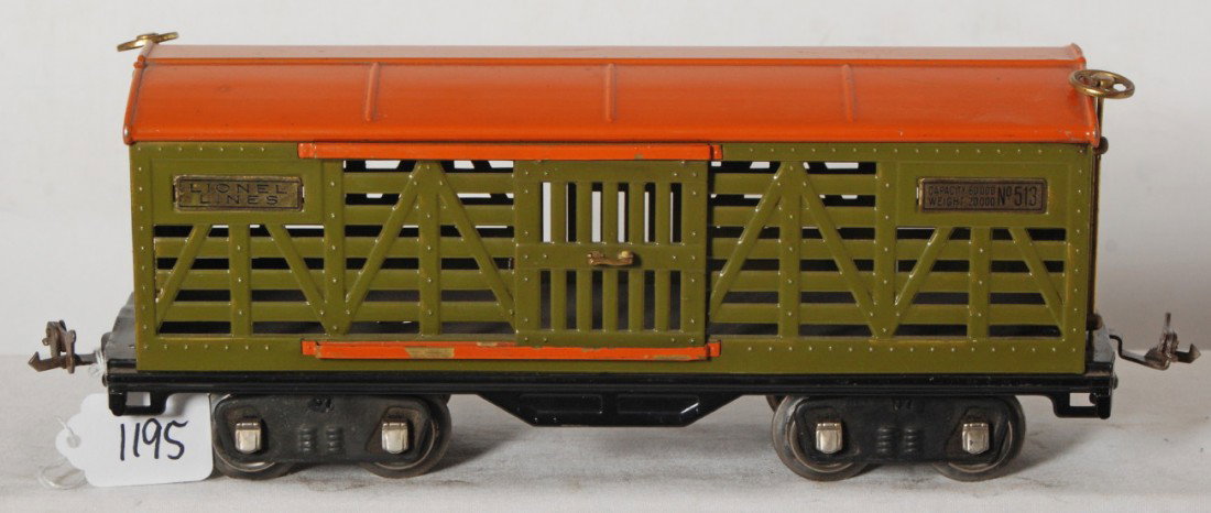 Lionel No. 513 cattle car in olive green w/orange: Prewar Lionel standard gauge No. 513 cattle car in olive green with orange roof and door guides, very clean and shiny C6+.