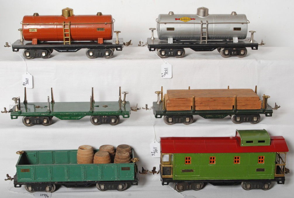 Lionel 511, 511, 512, 515, 515, 517 freight cars: Prewar Lionel standard gauge freight cars in nice clean and shiny C6 area. Two 511 flatcars (one has load), 512 gondola (five wooden 2 piece barrels, one broken), two 515 tank cars (one is Sunoco in s