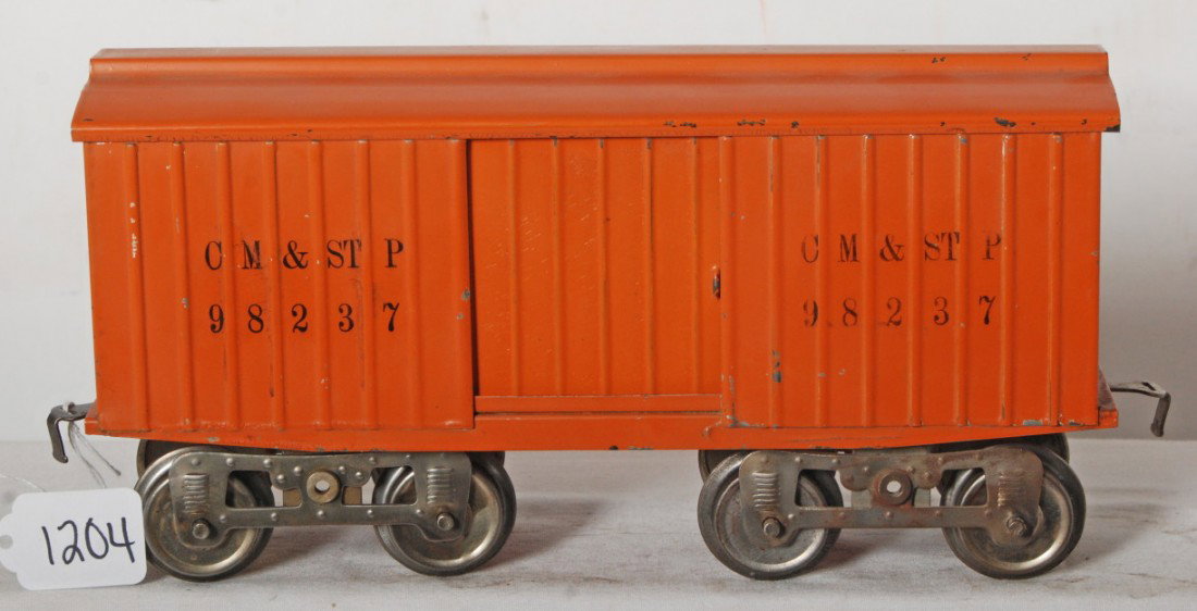 Lionel No. 14 boxcar CM&STP 98237 no brake wheels: Prewar Lionel standard gauge No. 14 boxcar, clean and shiny C6+. Embossed sides without stripes, black stamped CM&STP 98237, ink stamped on underside of frame, no brake wheels. Type IIIb trucks.