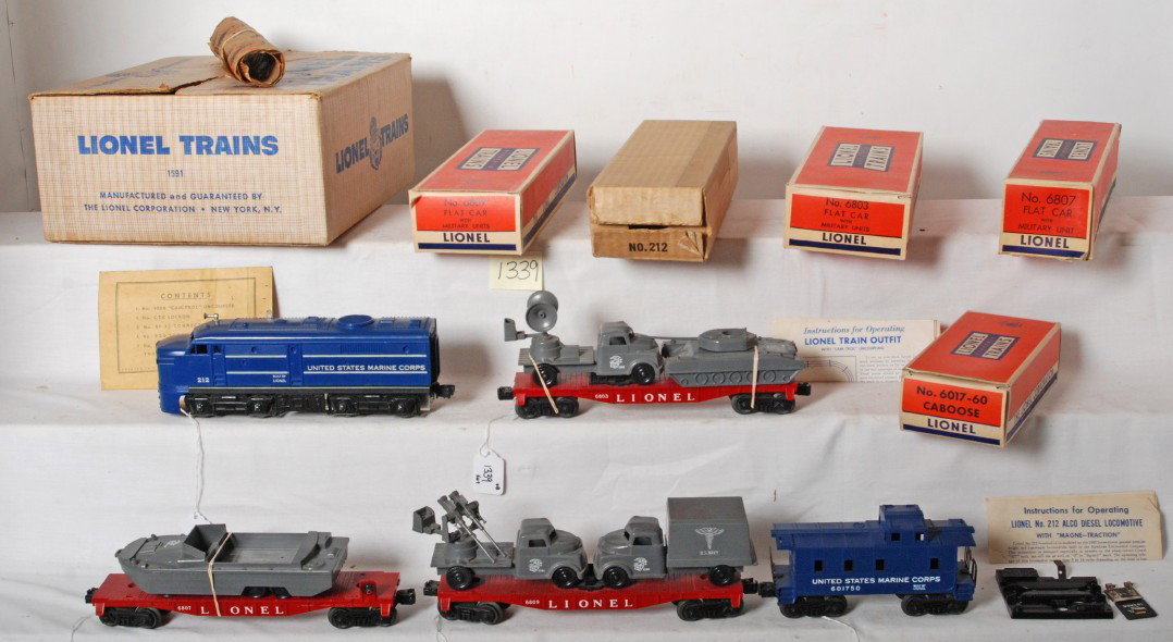 Lionel No. 1591 U.S. Marine Alco military set in : Postwar Lionel O gauge No. 1591 U.S. Marine Corps Alco diesel locomotive with 6803 flatcar with military units, 6807 flatcar with military unit, 6809 flatcar with military units, in original boxes. Tr