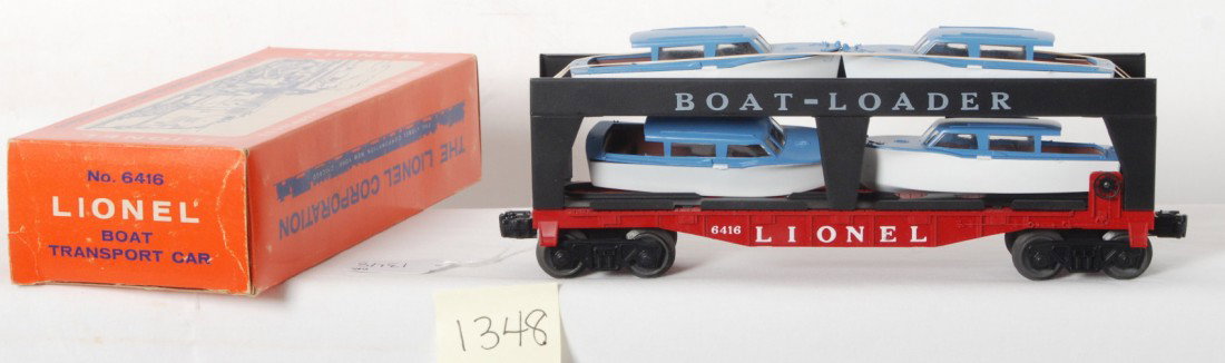 Lionel No. 6416 boat transport car in OB, Unrun: Postwar Lionel O gauge No. 6416 Boat-Loader boat transport car in original box, C9+ unrun. Box looks C7-8 bright and clean. One boat is missing a small piece of blue.