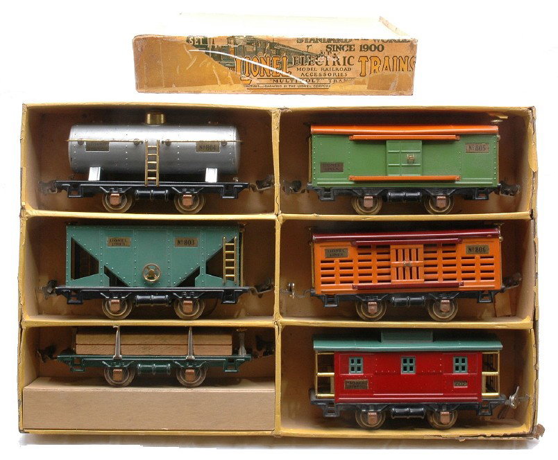 Lionel no. 808 Six Freight Car Set in Yellow OB: Lionel prewar O gauge no. 808 six freight car set in yellow set box containing; 804 aluminum tank, 803 peacock hopper, 831 dark green flatcar with wood load, 805 pea green boxcar with orange roof, 806