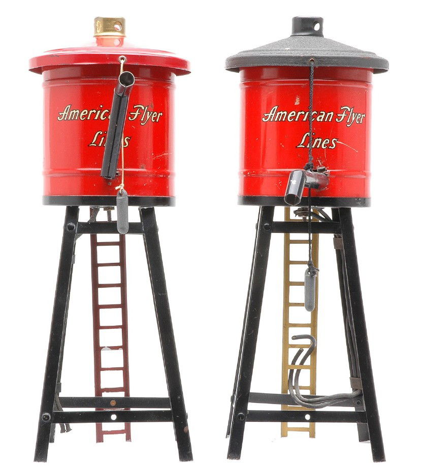 Am Flyer Prewar two 215 Red Water Tanks: American Flyer prewar two 215 red water tanks. One of the tanks has a black crackle roof and yellow ladder and the other water tank has a red roof and ladder. The water tanks are C7.