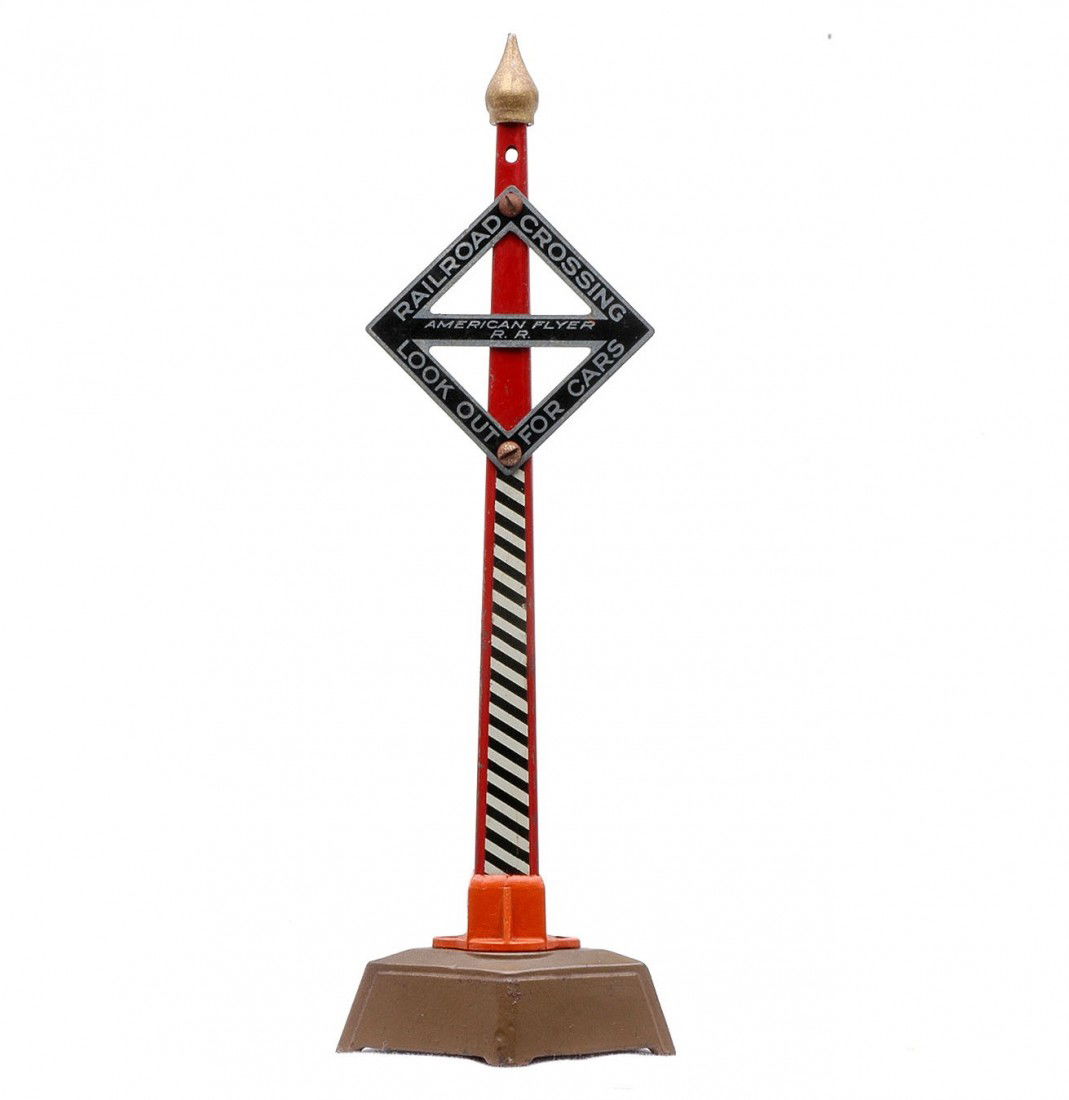 Am Flyer Prewar 2216 Crossing Warning Signal: American Flyer prewar 2216 crossing warning with a diamond shaped sign that is lettered RAILROAD CROSSING LOOK OUT FOR CARS. The die cast base is solid and intact. The accessory is C7.