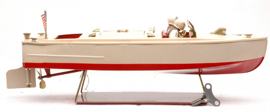 Lionel 43 Lionel Craft Clockwork Pleasure Boat: Lionel prewar no. 43 Lionel Craft Pleasure boat with clockwork motor, key, the stand and brass trim. The flag on the boat has been replaced and the figures may have been repainted. Boat is C7-8.
