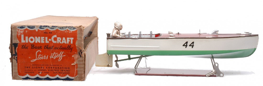 Lionel no. 44 Lionel Craft Racing Boat Boxed: Lionel prewar no. 44 Lionel Craft racing boat with clockwork motor, key and stand in OB. One of the nickel fittings is broken off of the deck but is included. The boat is C7. The OB has all flaps atta