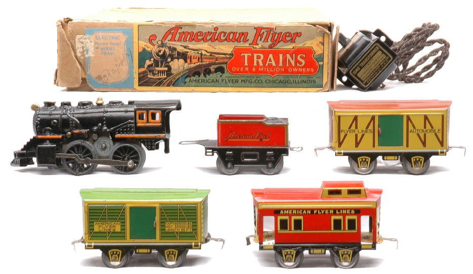 AF Litho Freight Set 916 534 535 536 1048 OB: American Flyer prewar O gauge lithographed freight set in box containing; 916 loco/tender combination consisting of a 915 cast iron 0-4-0 black steam loco, 119 red/green/orange tender, 534 yellow/brow