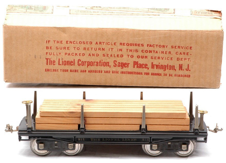 Lionel 211 Flatcar w/Wood Load LIKE NEW OB: Lionel prewar O gauge standard gauge 211 flatcar with brass trim, nickel journals and wood load in OB. Car is C8. The OB is sealed on the bottom and has all flaps attached on the top. The box and labe