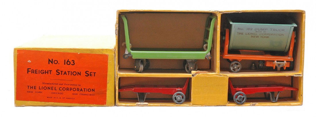 Lionel 163 Freight Station Set MINT Boxed: Lionel prewar O gauge 163 freight station set consisting of a 161 pea green baggage truck, 162 peacock dump truck with orange frame and two red hand trucks in OB with original cardboard insert. The se