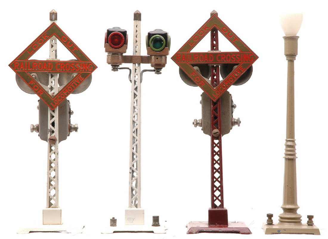 Lionel Accessories 53 Lamp 069 69 076 Signals: Lionel prewar accessories including; no. 53 light Mojave lamp post, 69 warning bell signal with white pole, brass sign and red lettering, 069 warning bell signal with maroon pole, brass sign and red l
