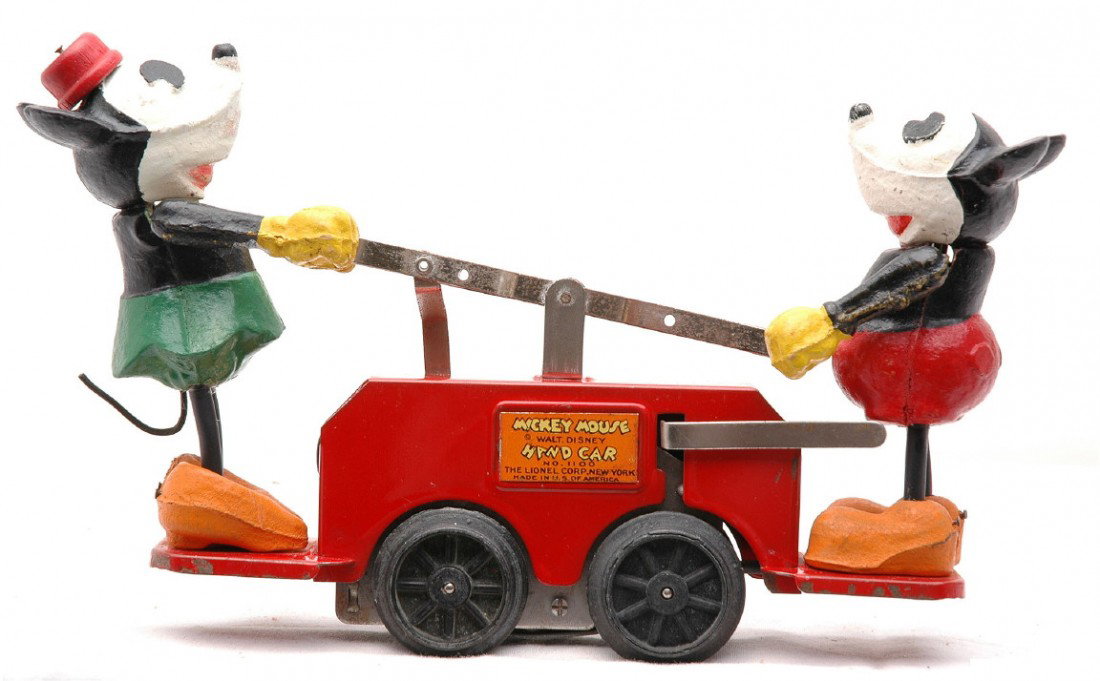 Lionel 1100 Red Mickey & Minnie Mouse Hand Car: Lionel prewar O gauge no. 1100 red Mickey and Minnie Mouse wind up hand car. The figures are complete, except for Mickey Mouse, who is missing his tail. The handcar is C7.