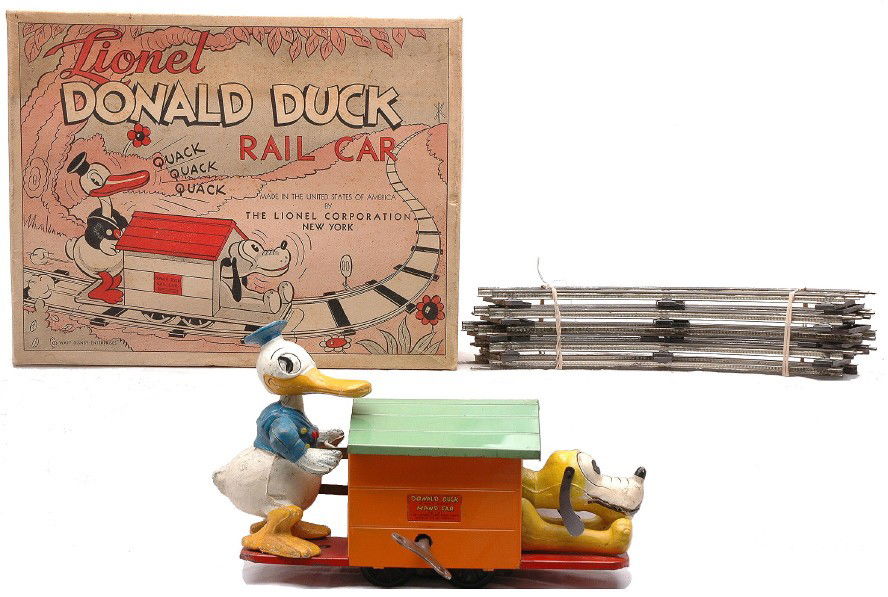 Lionel 1107 Donald Duck Wind Up Hand Car OB: Lionel prewar O gauge 1107 Donald Duck wind up hand car that has an orange dog house, key and eight curve track sections in OB with original inserts. The Donald and Pluto figures are complete and have