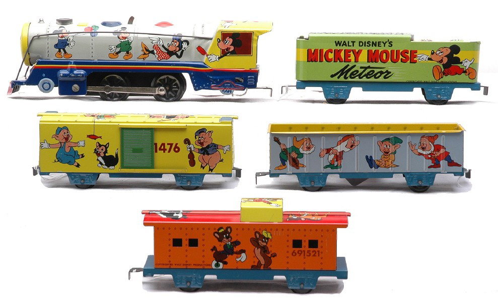 Marx Walt Disney 934 Mickey Mouse Meteor Set: Marx Walt DisneyÕs Mickey Mouse Meteor tin wind up lithographed train set no. 934, circa 1950-51 including 994 loco with key, tender, gondola, boxcar and caboose. The lithography has vivid and clean 