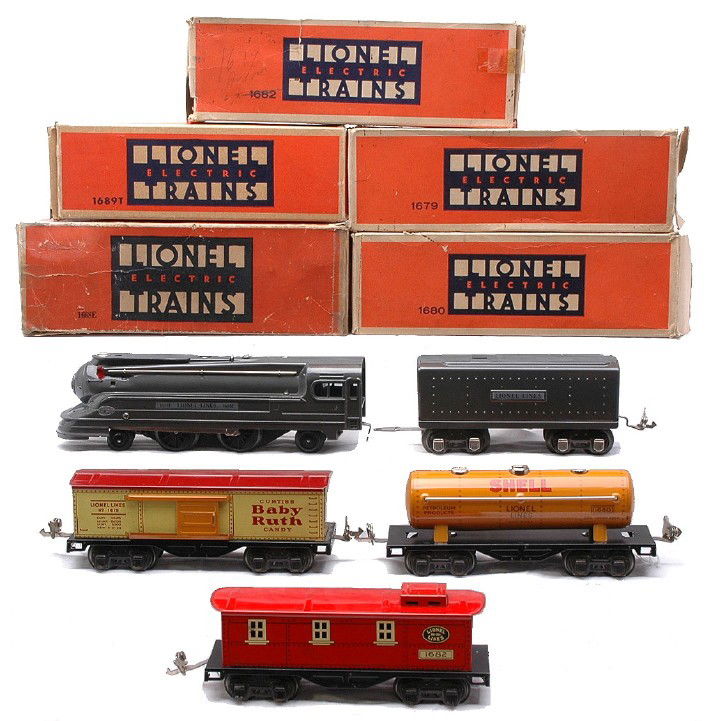 Lionel 1073E 1688E 1689T 1679 1680 1682 LN OBs: Lionel prewar O gauge lithographed freight set no. 1073E, circa 1939-40 containing; 1688E gunmetal 2-4-2 steam loco, 1689T tender, 1679 Baby Ruth boxcar, 1680 orange Shell tank car and a 1682 red cabo