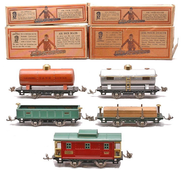 Lionel Freights 804 804 Tanks 831 902 807 OBs: Lionel prewar O gauge four wheel freight cars; 804 silver aluminum tank, 804 terra cotta tank, 831 dark green flatcar with wood load, 902 peacock gondola and an 807 red caboose with peacock roof and w