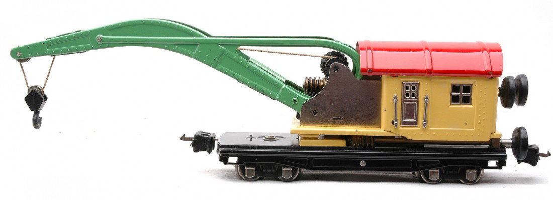 Lionel 810 Crane Car w/Nickel Trim Black Knobs: Lionel prewar 810 crane car with cream cab, red roof, light green boom, black knobs, nickel trim and journals. The cab roof has one scratch and box rubs on edge of cab roof and boom. Crane car is C7-8