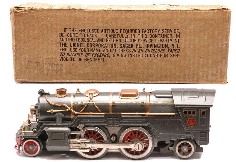 Lionel 385E Gunmetal 2-4-2 Steam Loco OB: Lionel prewar standard gauge 385E gunmetal 2-4-2 steam loco with copper and brass trim in worn OB. The steam chest on the loco has been restored. The loco is C7.