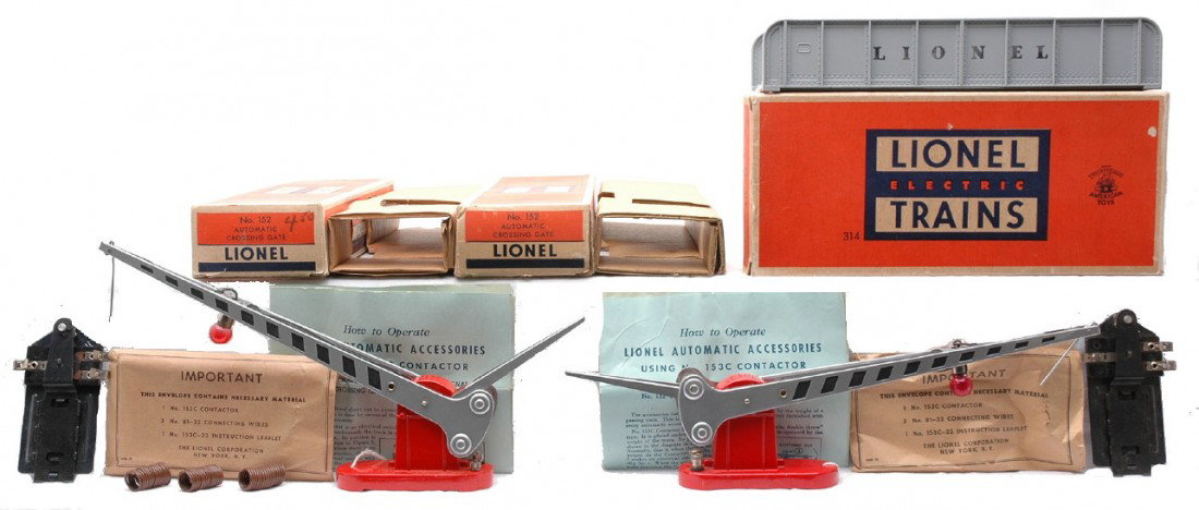 Lionel two 152 Crossing Gates 314 Bridge MIB: Lionel postwar two 152 automatic crossing gates both with 153 contactors, instruction sheets and packets and one with wires both in OBs with original cardboard inserts. The OBs have most flaps attache