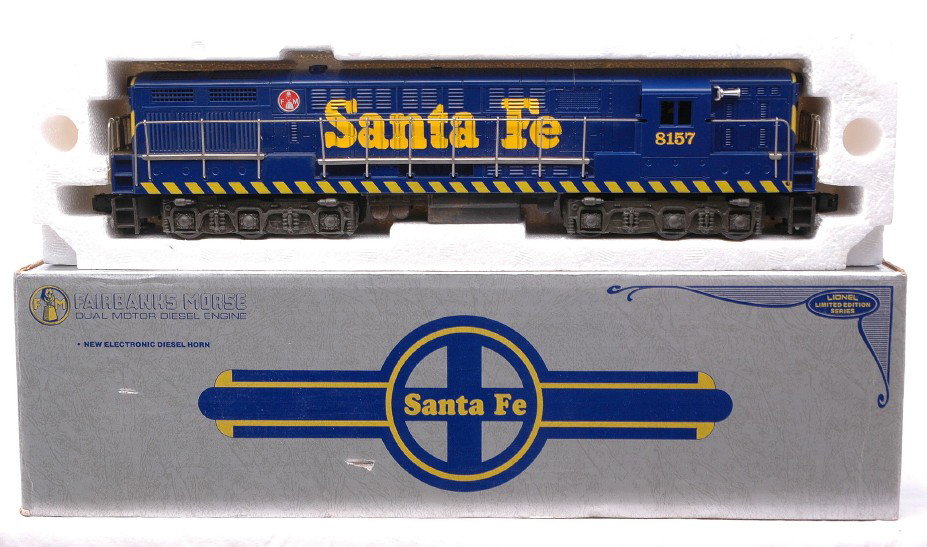 Lionel 8157 Santa Fe FM Train Master Diesel OB: Lionel 8157 Santa Fe FM Train Master diesel engine in OB. The frame has some damaged areas on the paint and has discoloration, otherwise diesel is C8.