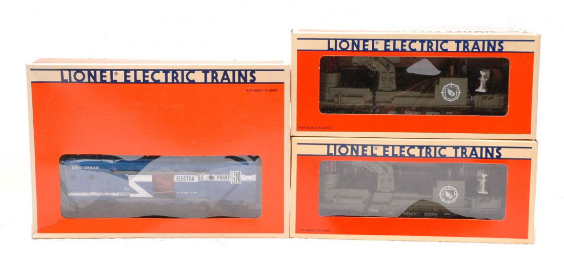 Lionel 19825 Generator Car 2-16726 Army Fire: Lionel 19825 electric power generator car and two 16726 U.S. Army fire ladder car all in OBs. The inserts for the 16726 are covered with black mold from water damage. The cars have never been run, C9-