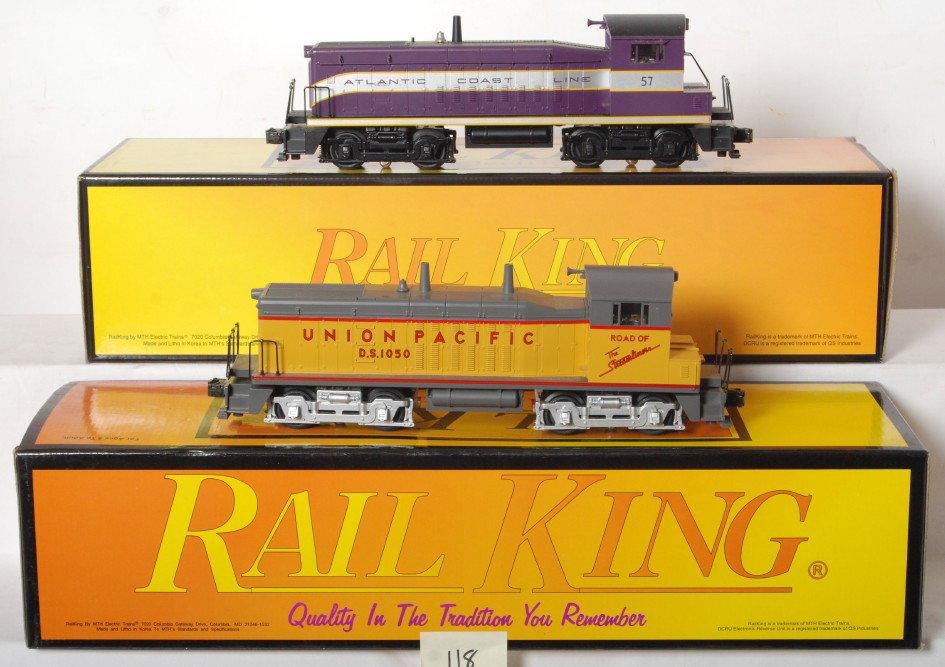 Railking NW2 UP and SW8 ACL switchers with Proto: MTH Railking modern O gauge diesel switcher locomotives in OBs. Includes 30-2138-1 Union Pacific NW2 and Atlantic Coast Line 30-2146-1SW-8. Locos feature Protosound and Protocouplers. Locos are C8 wit