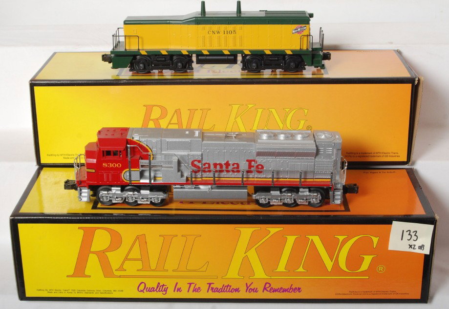 Railking Santa Fe SD90 and Chicago and Northwester: MTH Railking modern O gauge Santa Fe SD90 diesel locomotive with Proto and Chicago and Northwestern NW-2 calf dummy unit. Catalog numbers are 30-2121-1 and 30-2139-3. Santa Fe loco features Protosound