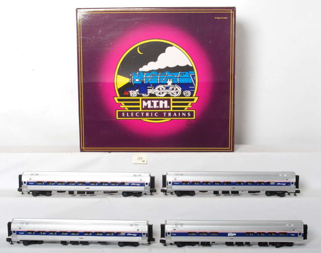 MTH Amtrak Amfleet passenger set 20-6531: MTH modern O gauge Amtrak Amfleet four car passenger set in OB. Catalog number is 20-6531. Cars are lettered for the Northwest Corridor and are C8 condition with run time, some very light spotting on 