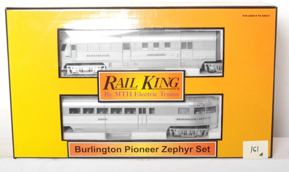 Railking Burlington Pioneer Zephyr with Proto: MTH Railking modern O gauge Burlington Pioneer Zephyr set in OB. Catalog number is 30-2186-1. Set features Protosound. Set is C8 condition with run time. Set has some very light spotting on the roof.