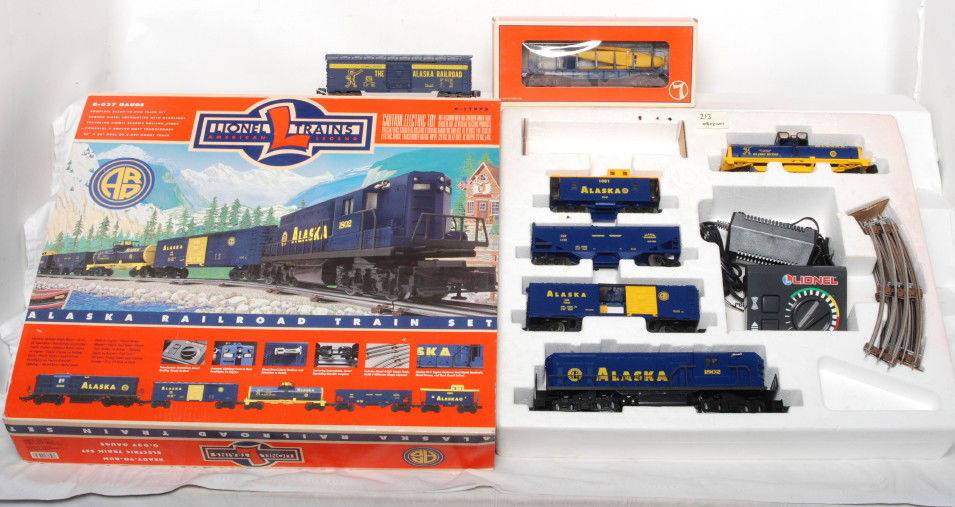 Lionel 11972 Alaska set with extras: Lionel modern O gauge 11972 Alaska train set in OB. Set in C7-8 condition and is missing the straight track. Also included 9758 Alaska boxcar with no box and 36021 Alaska flatcar with airplane. Cars a