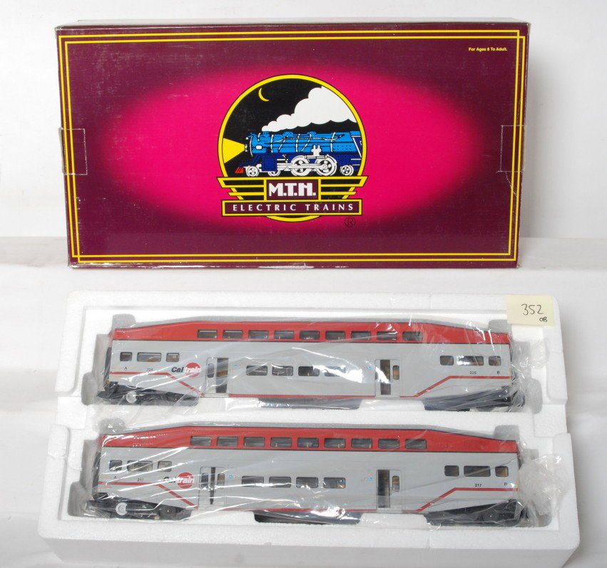 MTH Cal Train 20-66049 bombardier two pack: MTH modern O gauge two car passenger add on set. Set number is Cal Train bombardier 20-66049 two pack . Cars are C9-10 with no major signs of run time. OB does have some wear at the box end.