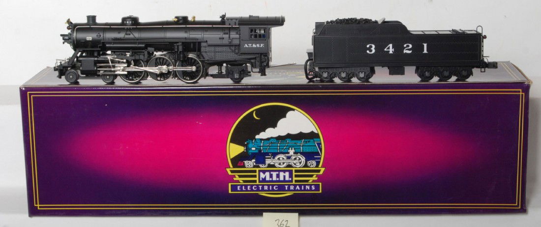 MTH Santa Fe USRA 4-6-2 steam locomotive: MTH modern O gauge Santa Fe USRA 4-6-2 steam locomotive in OB. Loco features Protosound, Protosmoke, Protocoupler, and more. Loco is C8 condition with run time. Locomotive original box has light corne