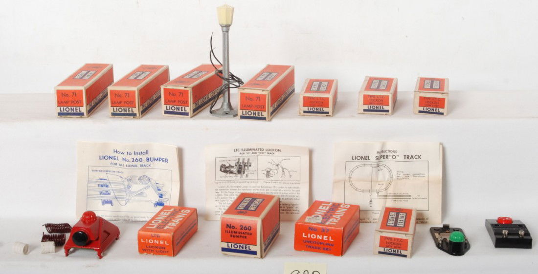 Lionel 37, 71, 260, five LTC in OB: Postwar Lionel O gauge layout/track accessories in very nice original boxes. Accessories look New Old Stock C8-10. Boxes look C9-10. Four No. 71 lamp posts, five No. LTC lockons with light, No. 37 unc